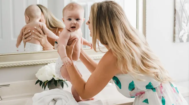 mom interacts with babbling baby