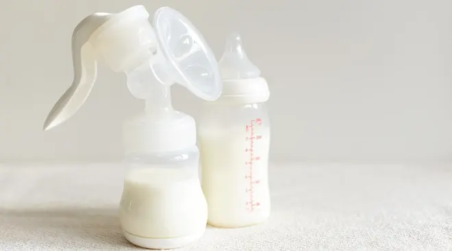 breast milk in bottle and breast pump