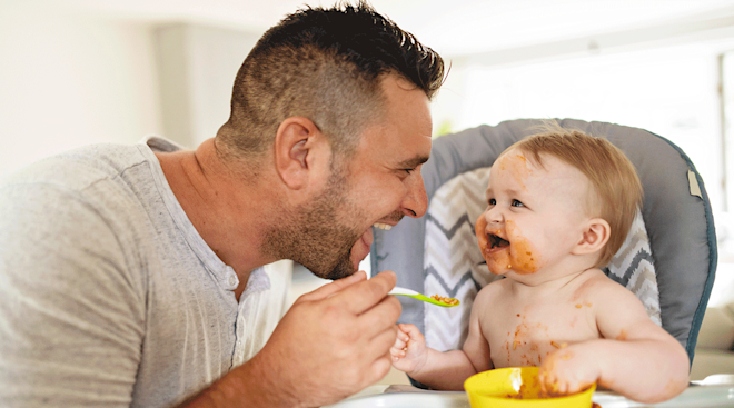 dad feeding baby
