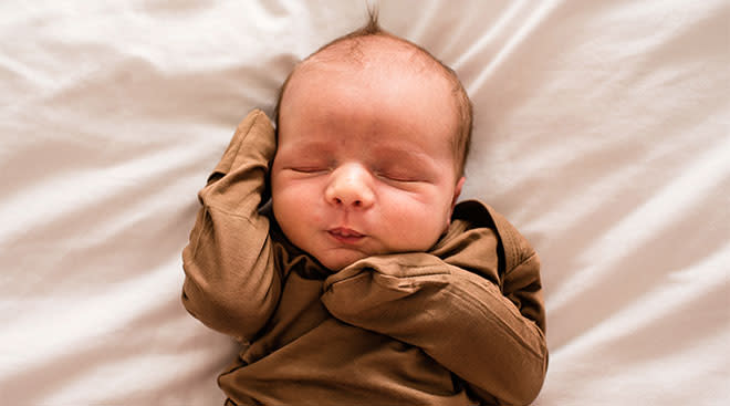 Cute newborn baby peacefully sleeping.