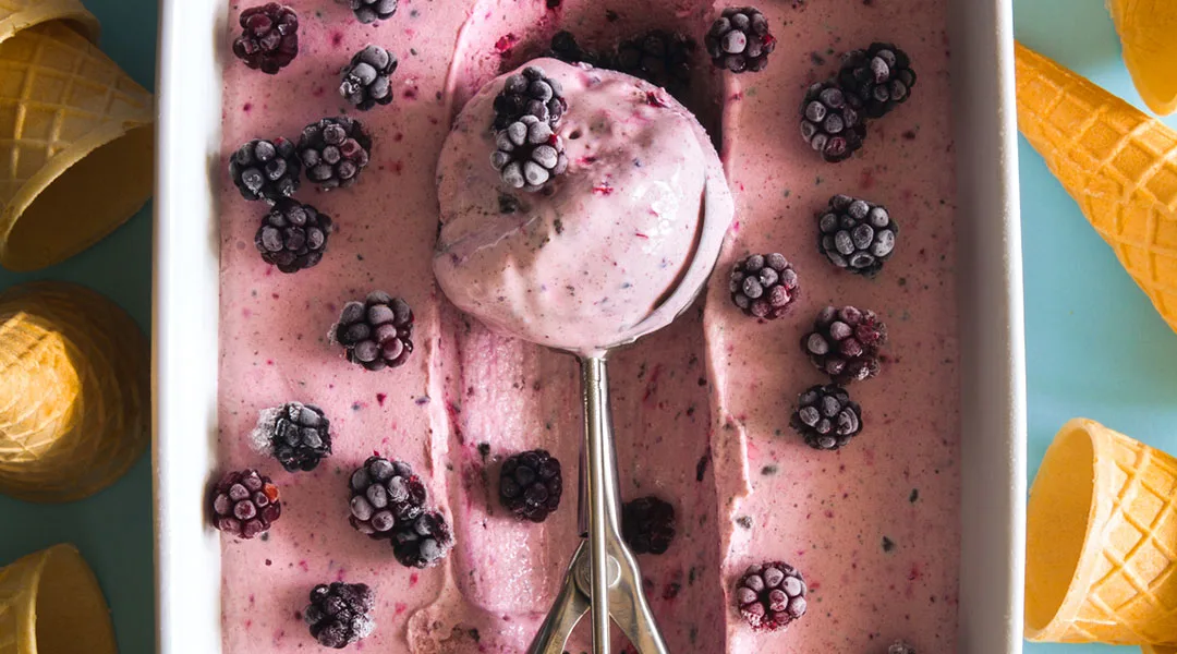 dish full of ice cream surrounded by ice cream cones