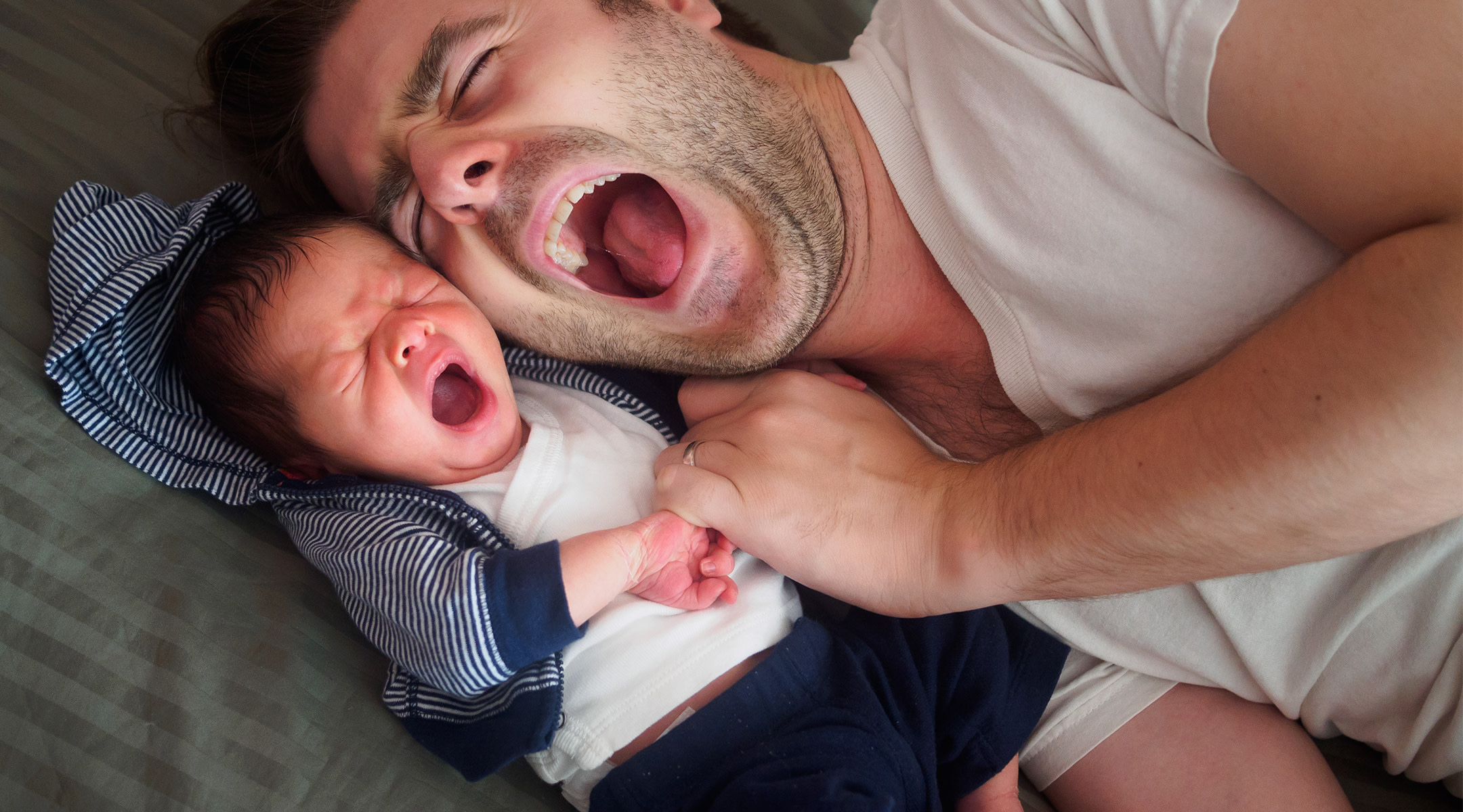 father and baby yawning
