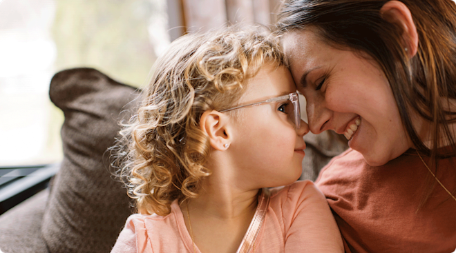 smiling mother and daughter