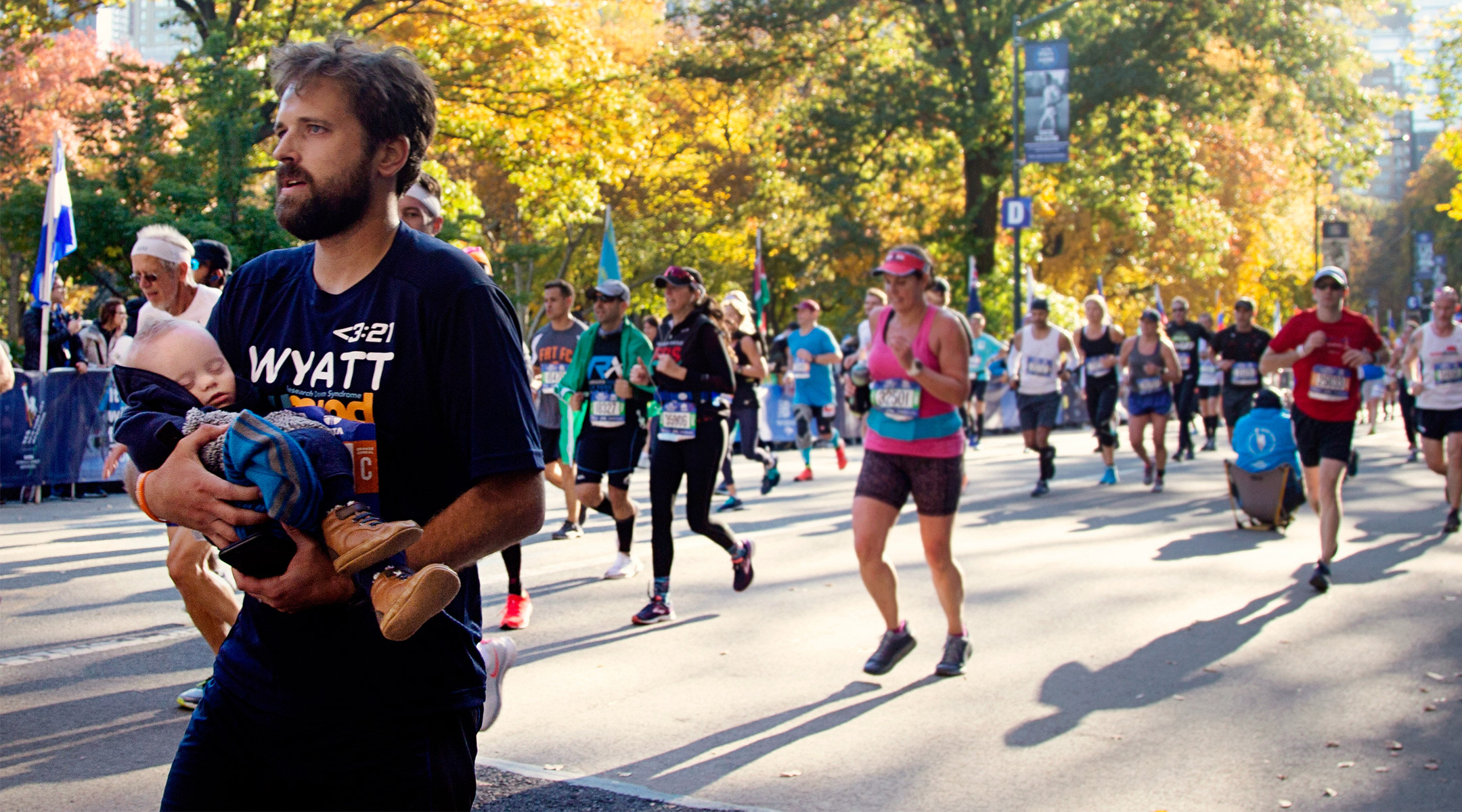 dad runs new york marathon and crosses the finish line with his baby son