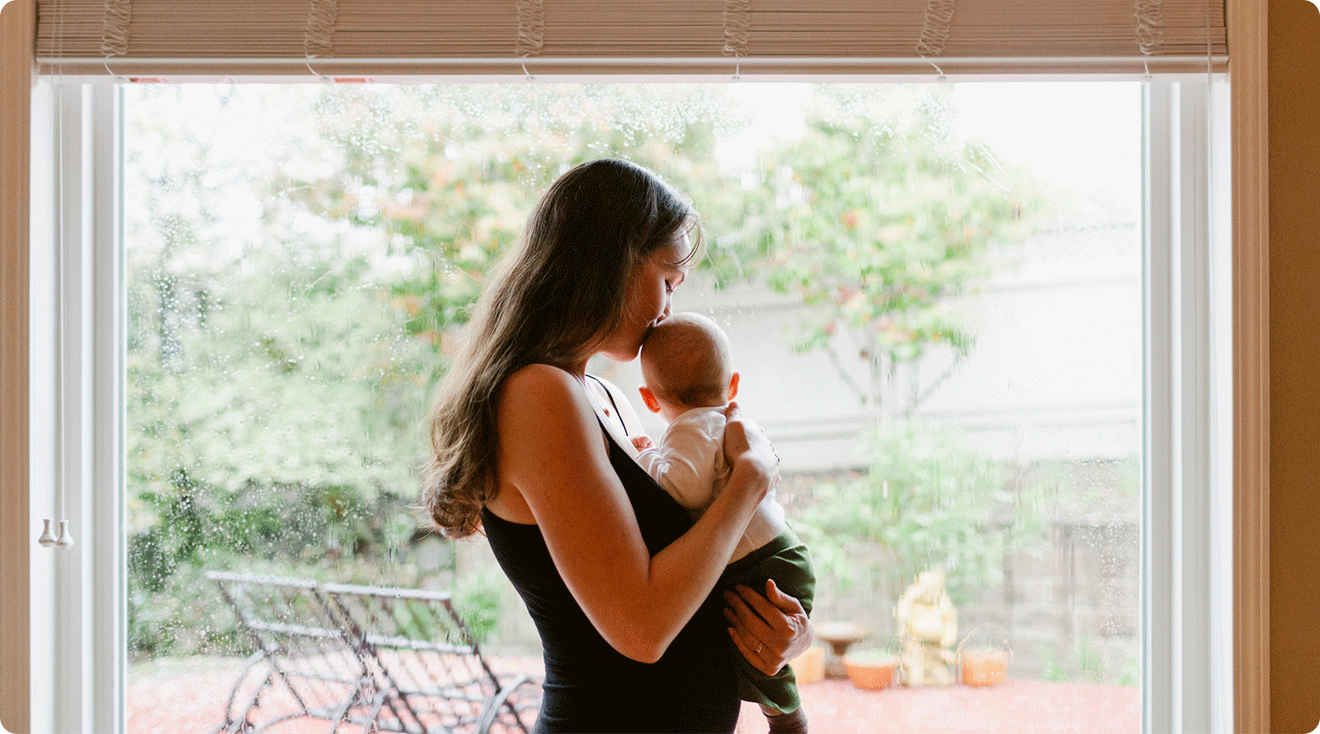 mom and baby inside during a rainy day
