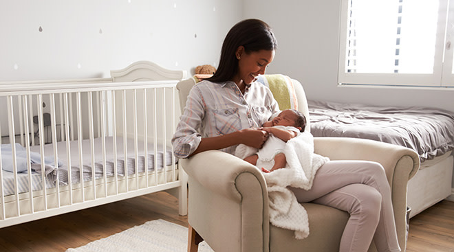Mom and baby in a stylish home nursery