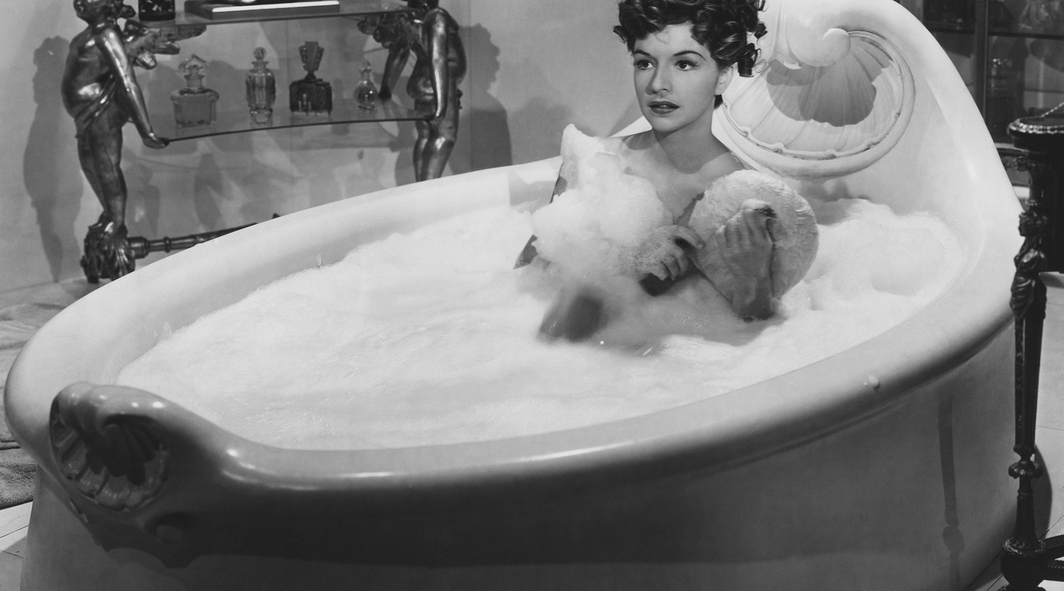 retro photo of woman in bubble bath