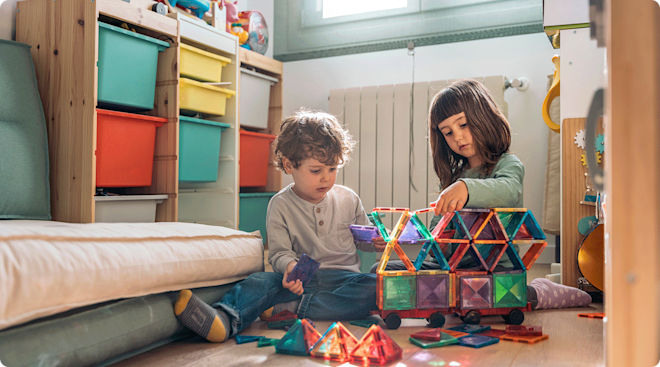 young children playing with rainbow magnetic tile toy