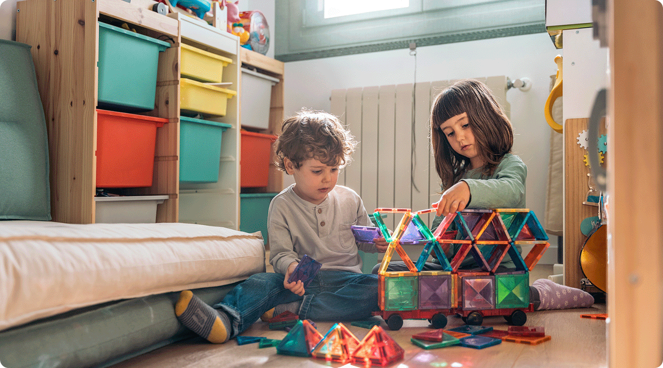 young children playing with rainbow magnetic tile toy