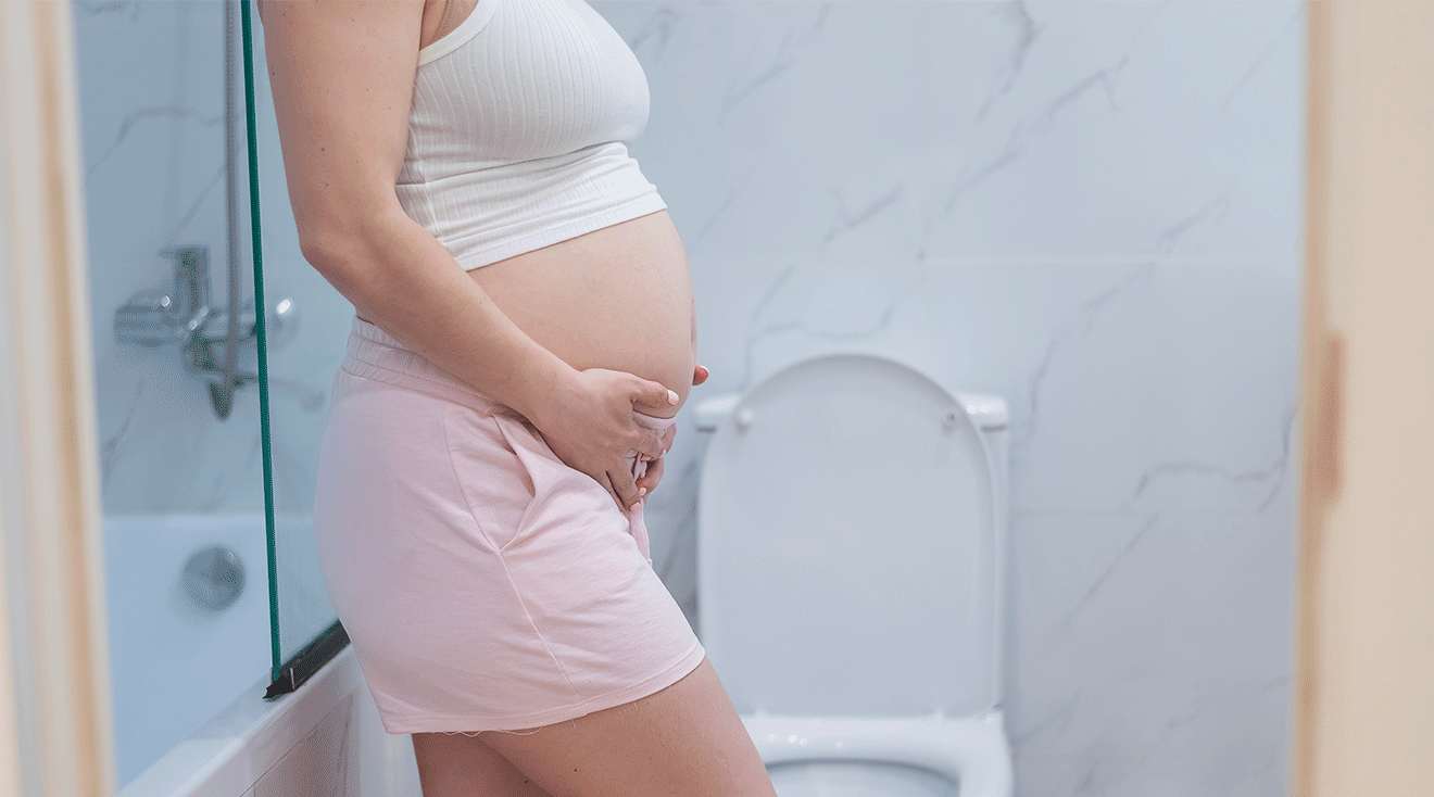 pregnant woman standing in bathroom