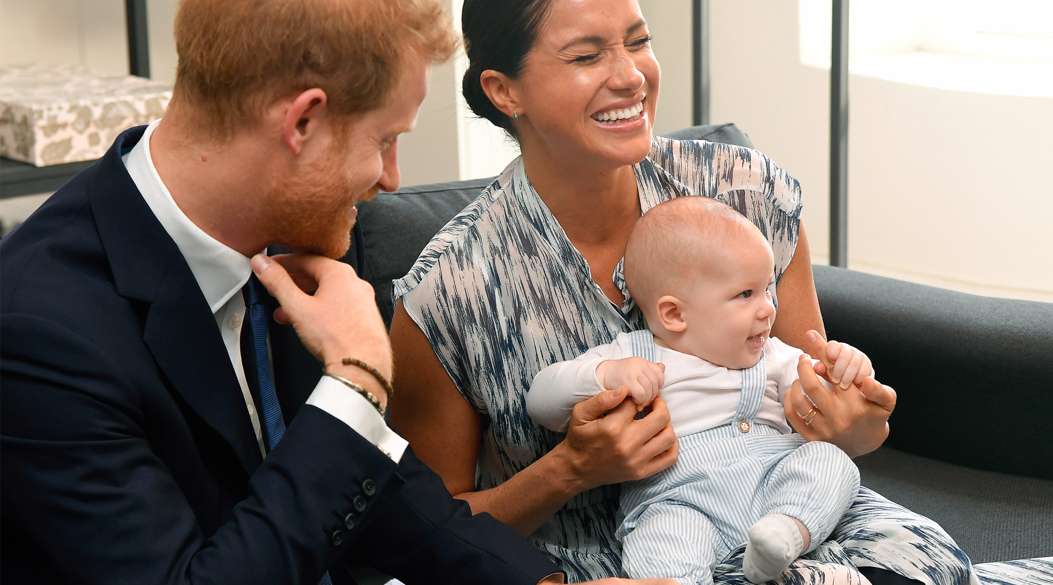 meghan markle and prince harry laughing with baby archie