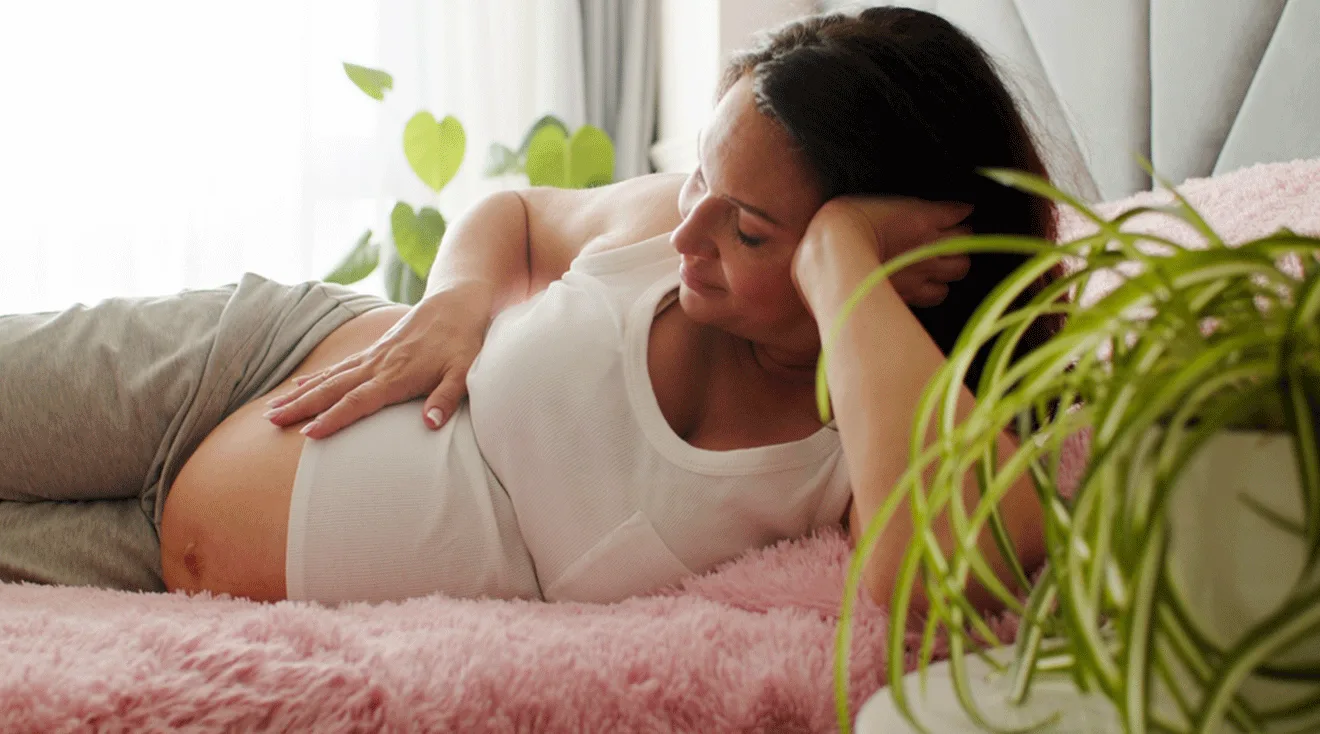 pregnant woman relaxing at home