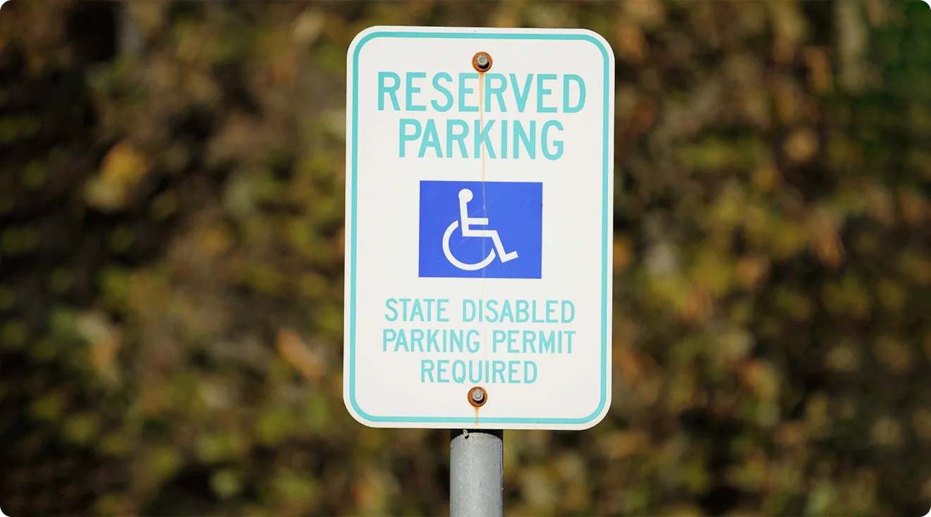 handicapped parking sign in parking space