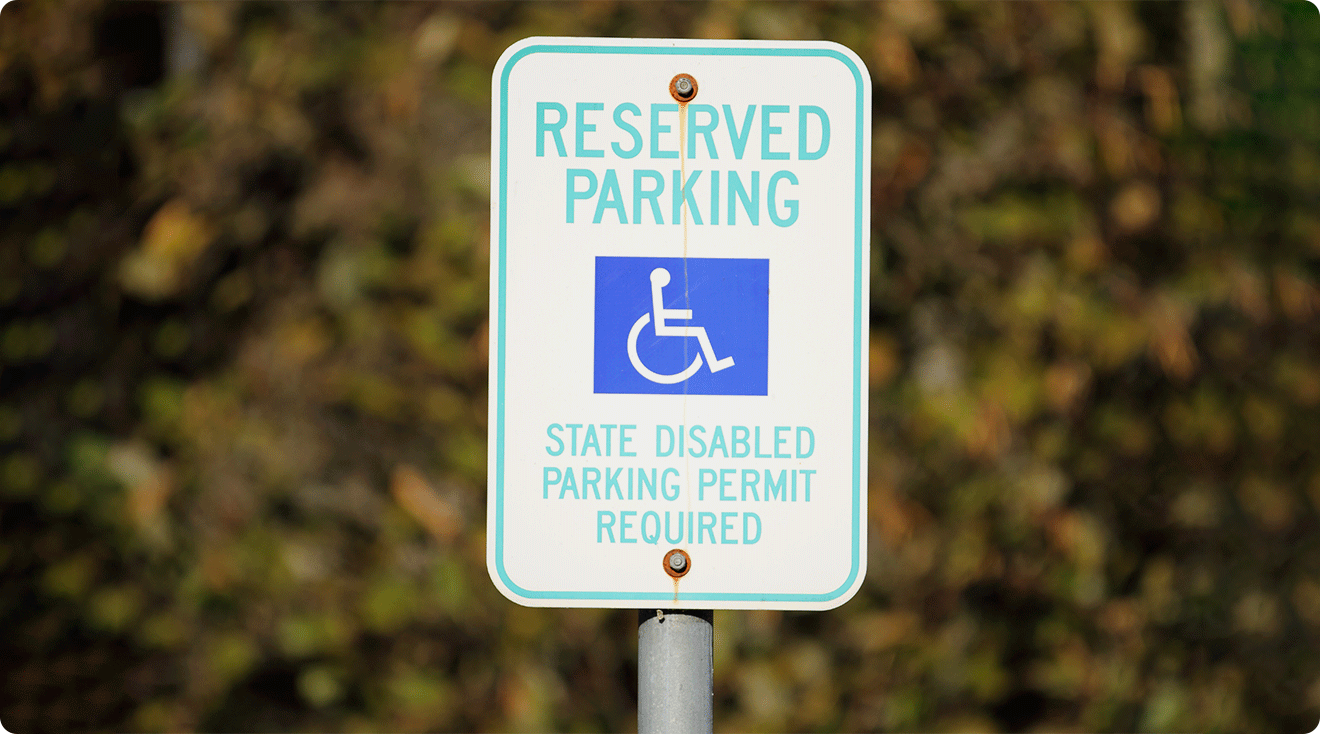 handicapped parking sign in parking space
