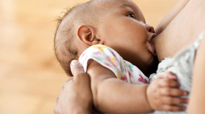 close-up mom breastfeeding baby