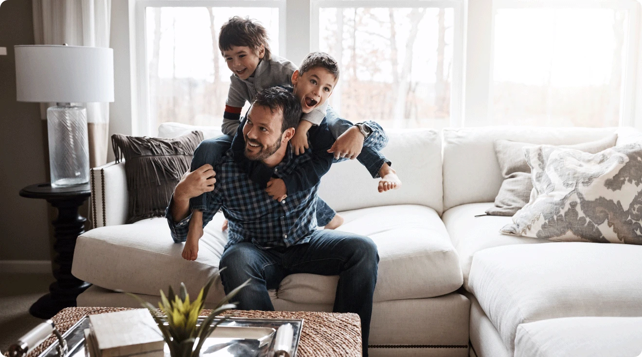 dad playing with kids at home