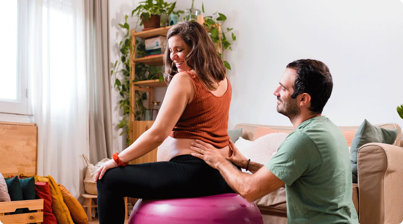 husband helping pregnant woman with labor by using pressure points to induce labor