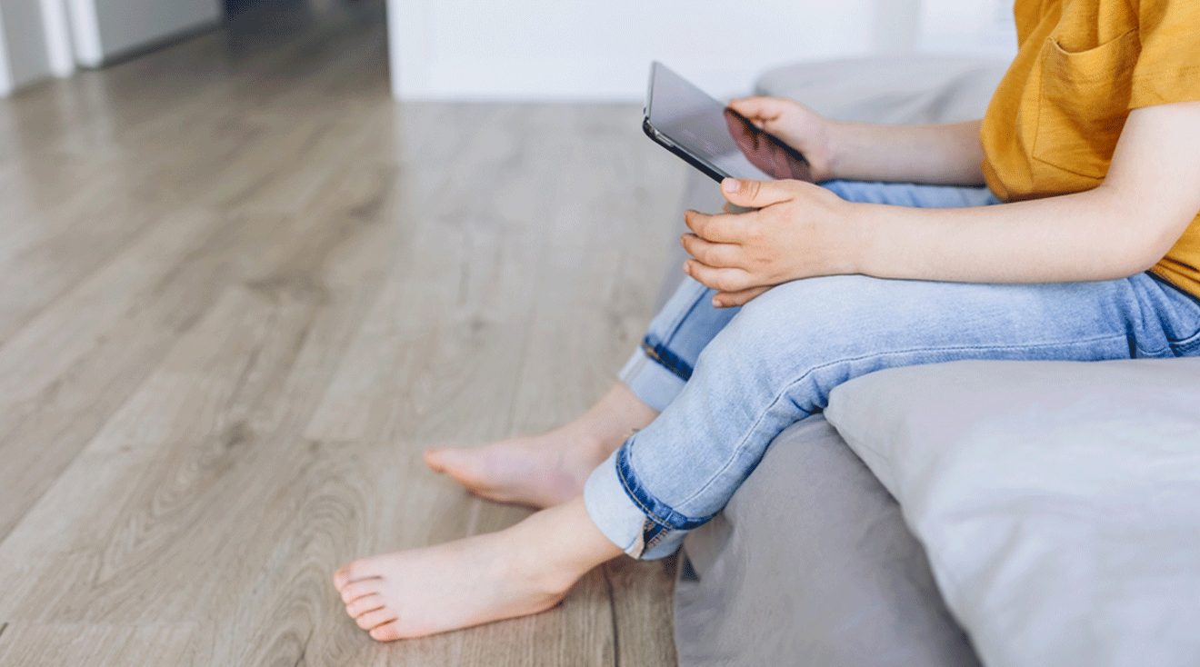 child using tablet at home