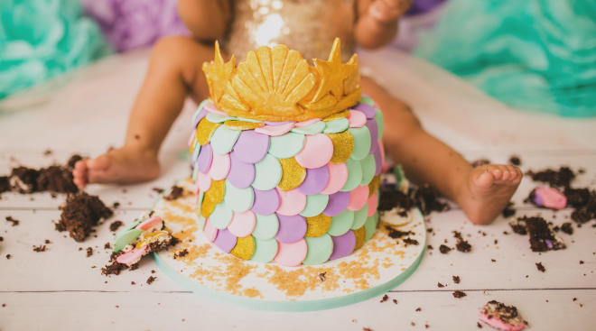 baby at cake smash photography session for first birthday