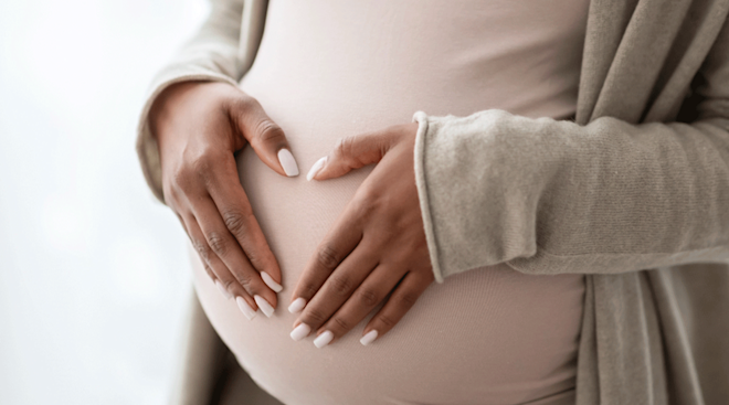 pregnant woman with hands on belly