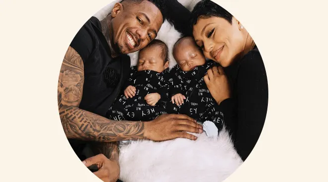 nick cannon and abby de la rosa posing with their twin babies