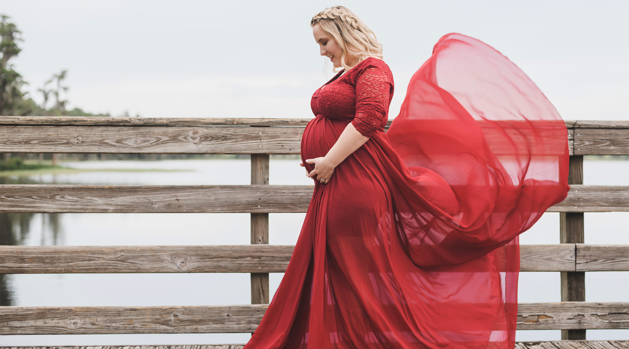 pregnant woman wearing beautiful flowy red dress