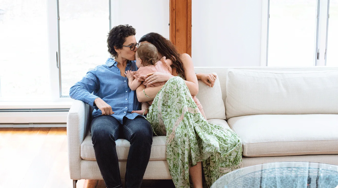 LGBTQ couple at home with their baby