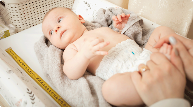 measuring baby length with measuring tape