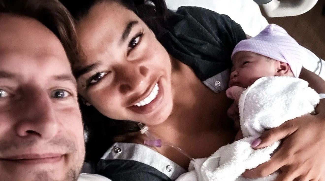 selfie of hannah bronfman and brendan fallis in hospital with their newborn baby