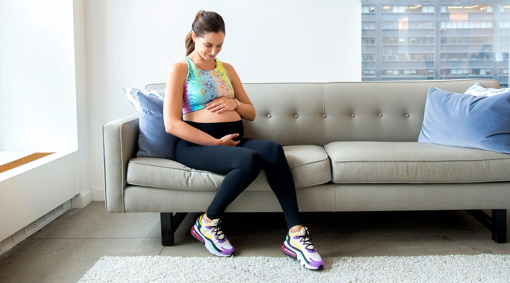 pregnant mother sitting on sofa