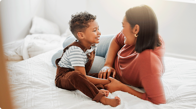 mom and toddler chatting at home