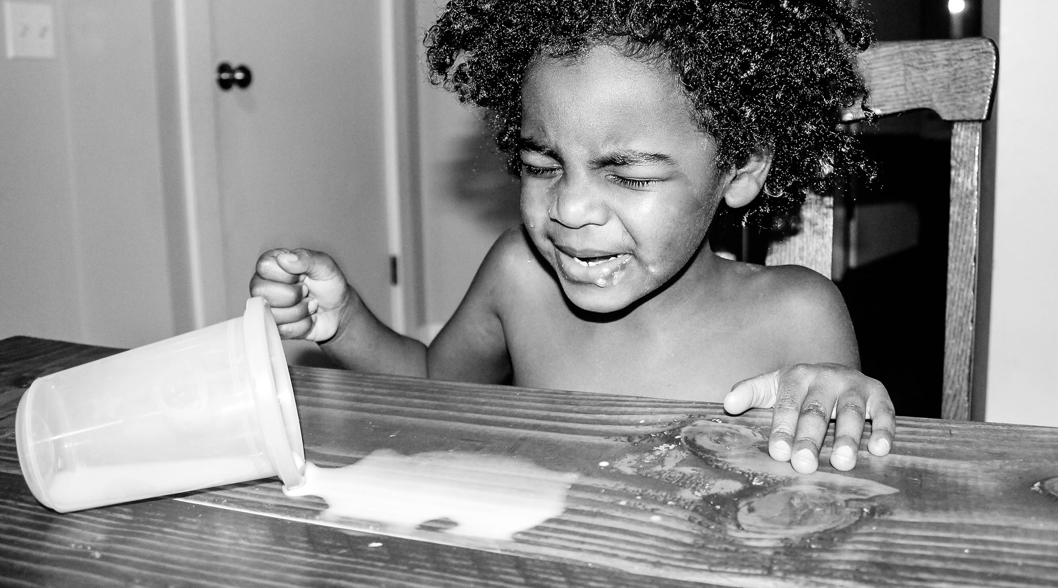 terrible twos toddler crying over spilled milk