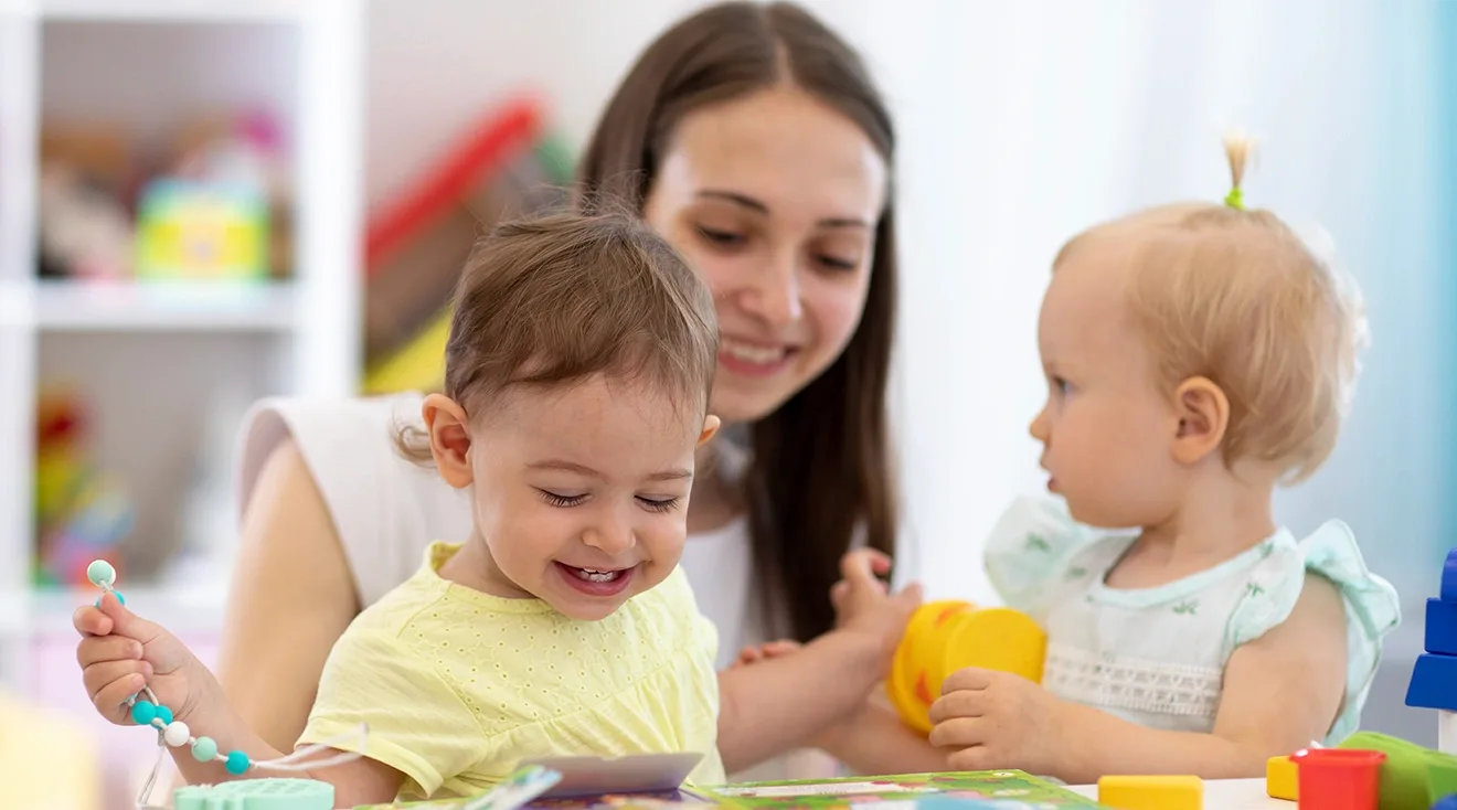 babies at daycare with caregiver