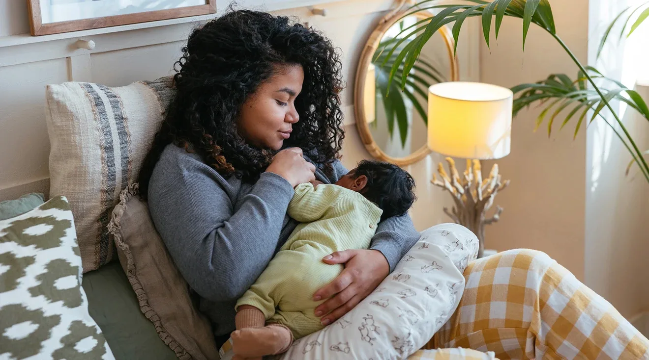 mother is feeding the baby