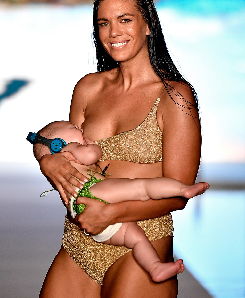 Swimsuit Model Walks the Runway While Breastfeeding Her Daughter