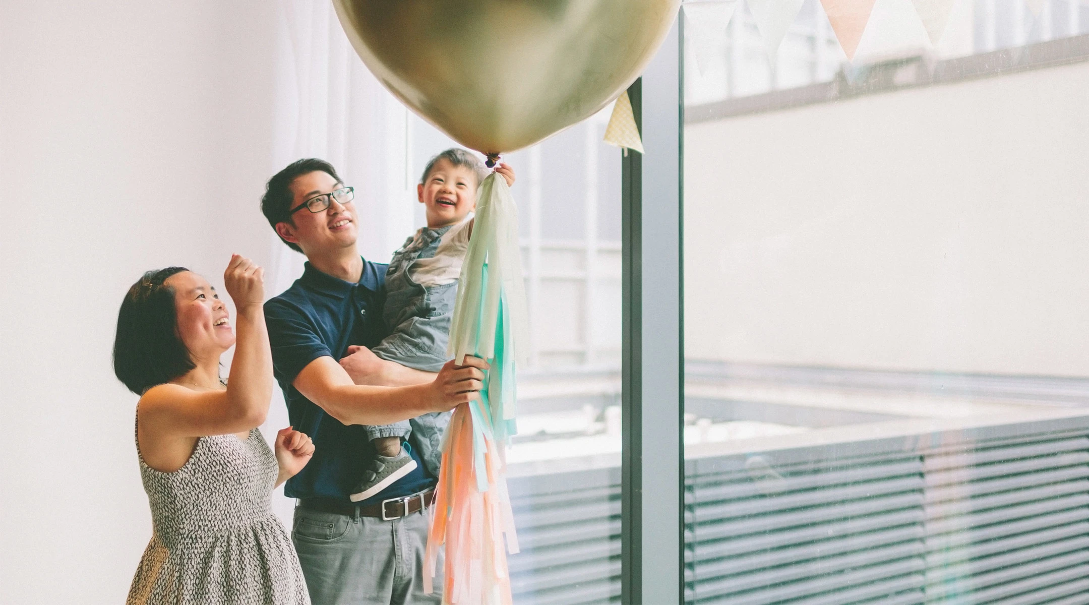 family about to pop their gender reveal balloon