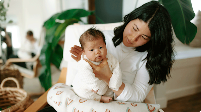 mom burping baby after feeding