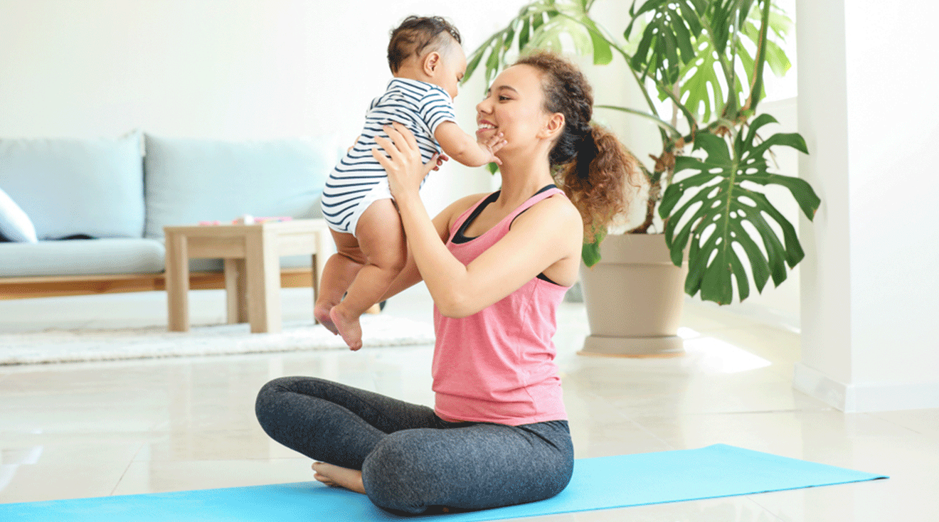 mom exercising with baby at home