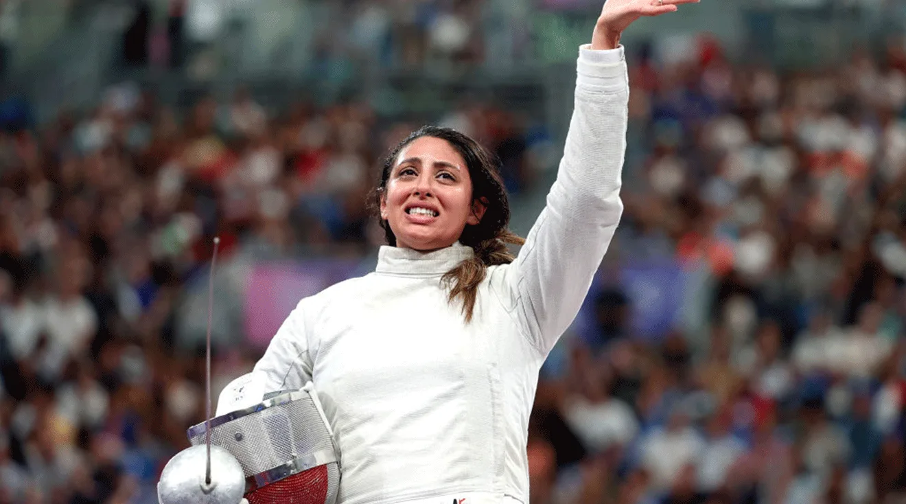  Nada Hafez of Team Egypt applauds after her victory against Elizabeth Tartakovsky of Team United States in the Fencing Women's Sabre Individual Table of 32 at the Olympic Games Paris 2024 at Grand Palais on July 29, 2024 in Paris, France