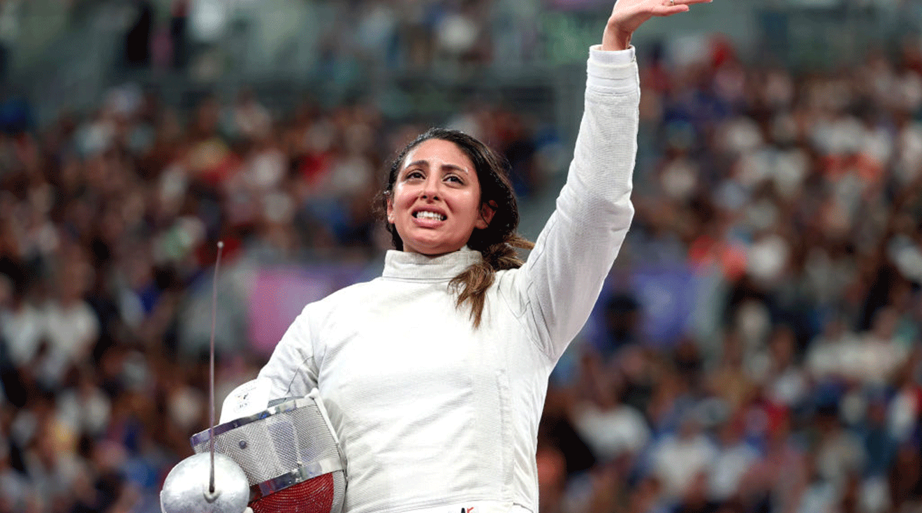  Nada Hafez of Team Egypt applauds after her victory against Elizabeth Tartakovsky of Team United States in the Fencing Women's Sabre Individual Table of 32 at the Olympic Games Paris 2024 at Grand Palais on July 29, 2024 in Paris, France