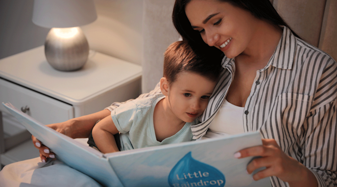 mom reading a bedtime story to son