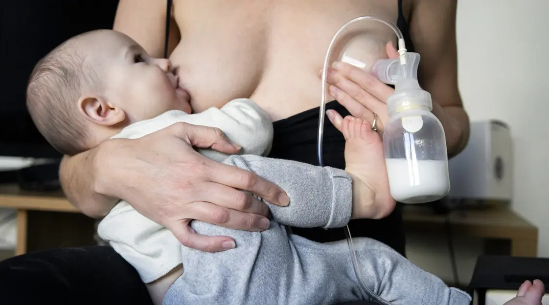 Milk flows from woman breast. Close up video of nipple. Breastfeeding.