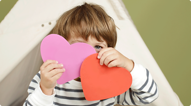 toddler doing valentines day crafts