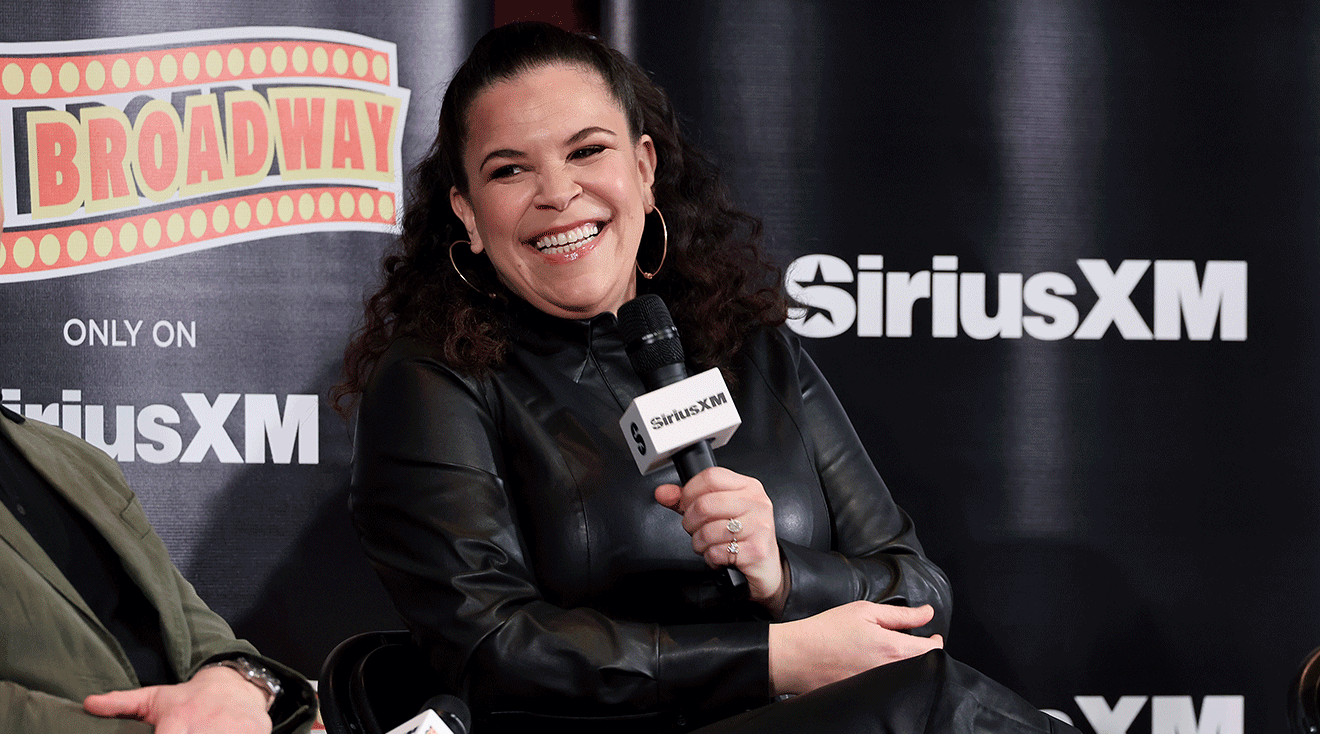 Lindsay Mendez speaking onstage during the SiriusXM On Broadway Town Hall With The Cast Of 'Merrily We Roll Along' at The Hudson Theatre on March 19, 2024 in New York City