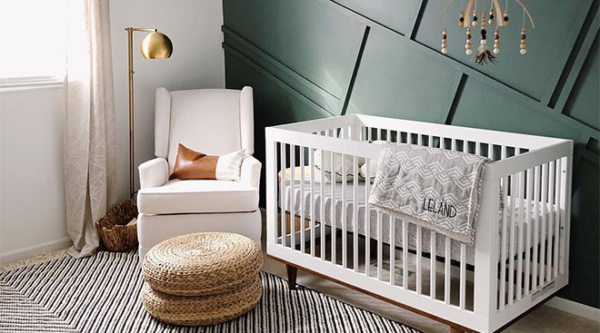 upscale baby boy nursery with green accent wall