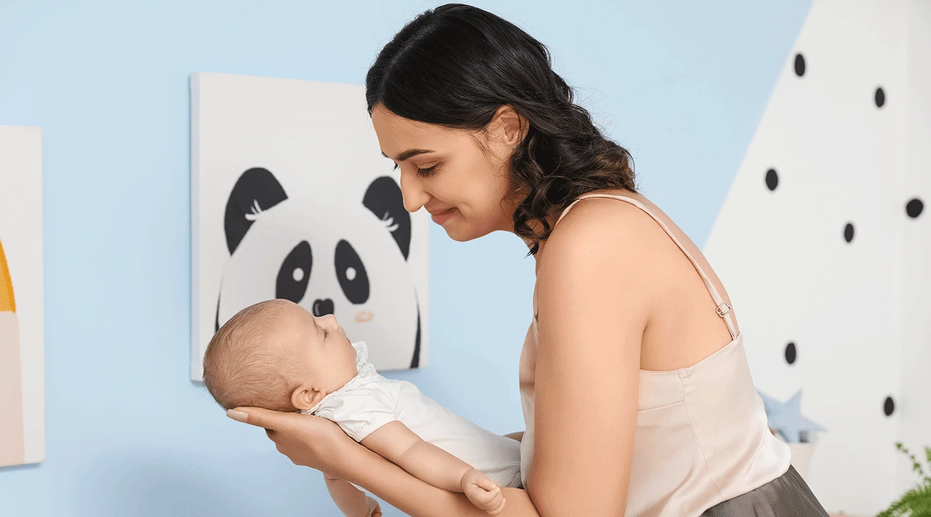 mom and baby in nursery room