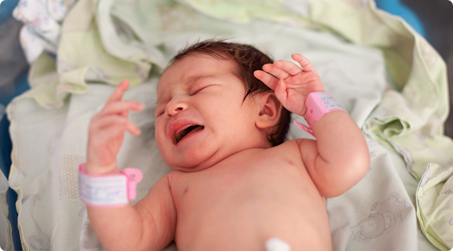 fussy newborn baby crying in hospital