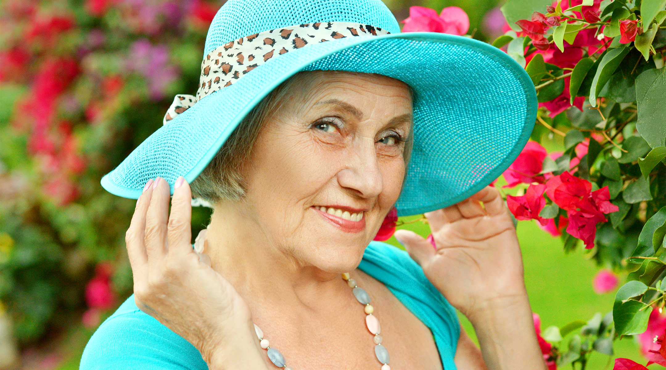 senior citizen wearing a fancy hat