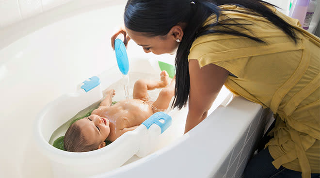 mom giving baby a bath