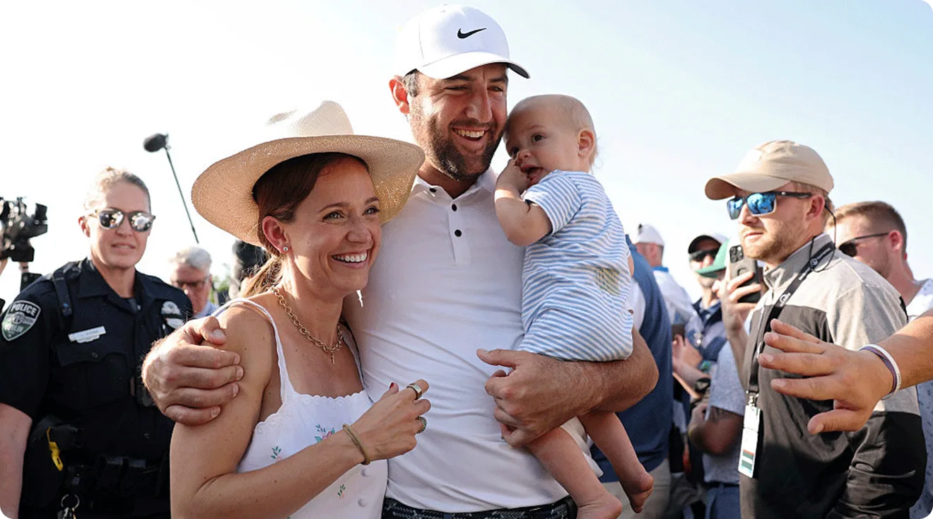 Scottie Scheffler of the United States celebrates with wife Meredith and son Bennett after winning the Memorial Tournament presented by Workday 2025 at Muirfield Village Golf Club on June 01, 2025 in Dublin, Ohio.